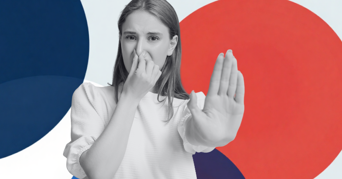 Woman smelling something bad